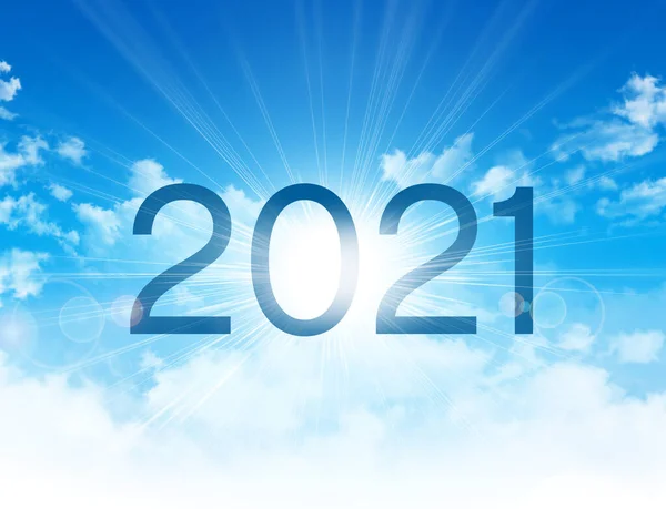 New Year 2021 date number, high in blue sky with morning sunrise, as the beginning of a new day