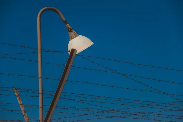 Fence with barbed wire. Security Tools. — Stock Photo, Image