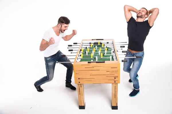 Boys play table football. The emotions of winning and losing. Wh — Stock Photo, Image