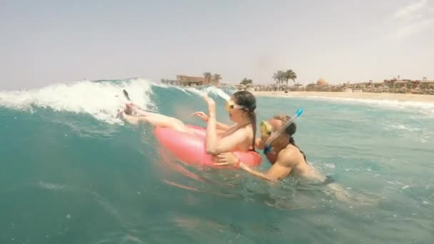 Sea Wave Man Woman Inflatable Ring Ride Sea Wave — Stock Video