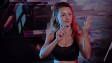 Gesture. The woman shows with hand gestures to write comments to her on social networks.