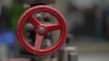 Valve. The valve is red. Close-up.