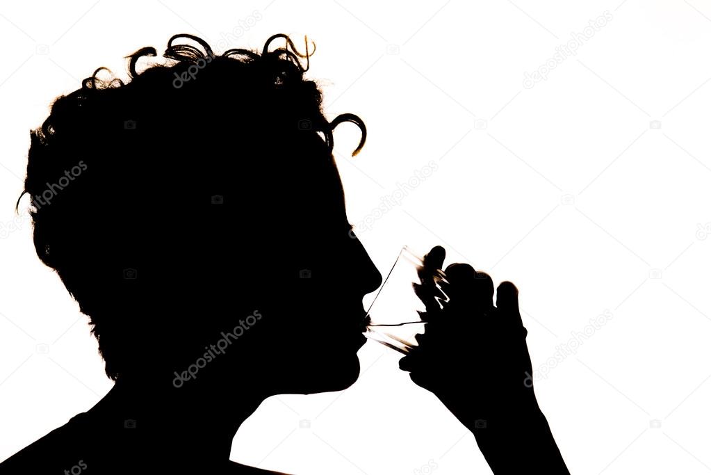 Silhouette of the girl drinking water