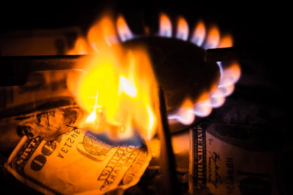 Gas stove. Dollars on a gas cooker — Stock Photo, Image