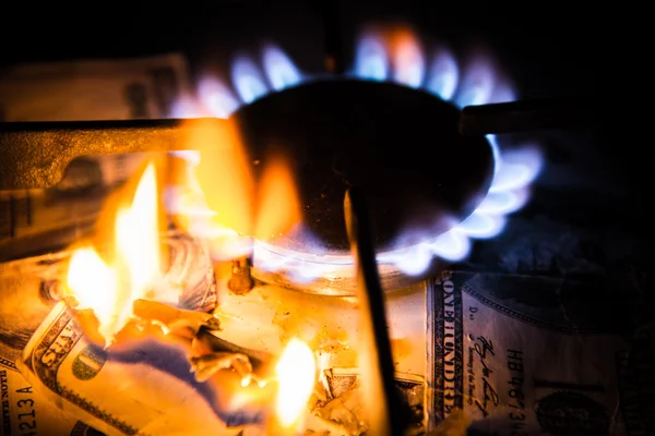 Gas stove. Dollars on a gas cooker — Stock Photo, Image