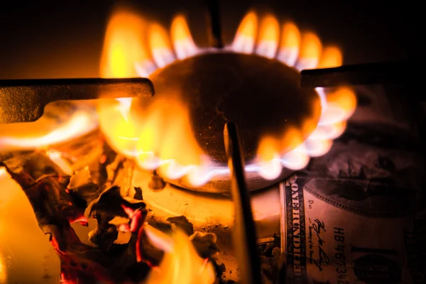 Gas stove. Dollars on a gas cooker — Stock Photo, Image