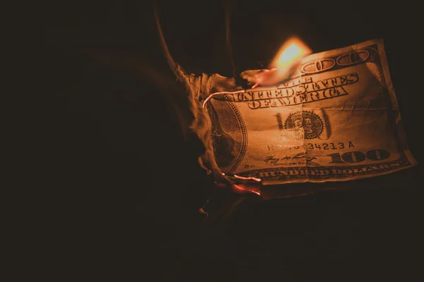One hundred dollar bill on fire. Treatment with toning effect — Stock Photo, Image
