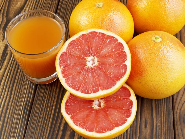 Grapefruit juice in glass — Stock Photo, Image