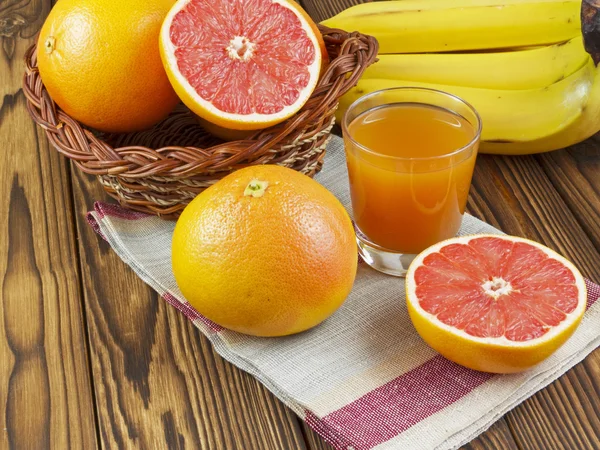 Grapefruit juice in glass — Stock Photo, Image