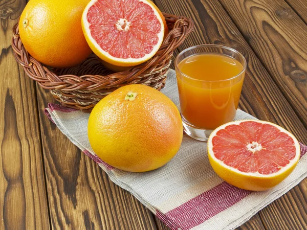 Grapefruit juice in glass — Stock Photo, Image