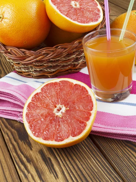 Grapefruit juice in glass — Stock Photo, Image