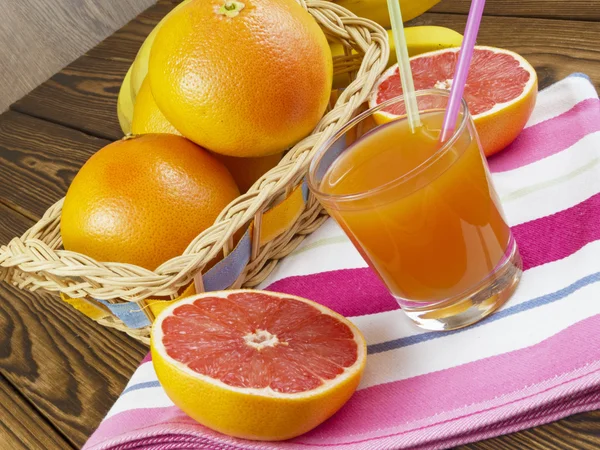 Grapefruit juice in glass — Stock Photo, Image