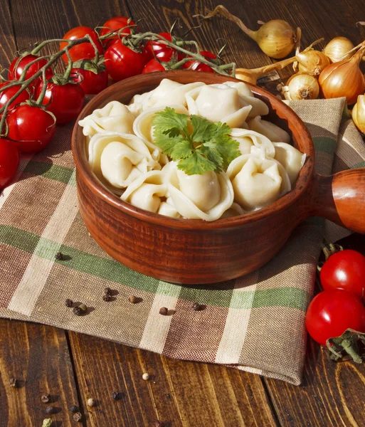 Dumplings with meat on a wooden table — Stock Photo, Image