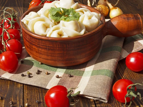 Dumplings with meat on a wooden table — Stock Photo, Image