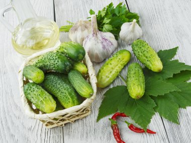 fresh cucumbers on a wooden table clipart