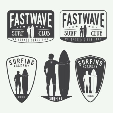 Set of surfing logos, labels, badges and elements in vintage style.