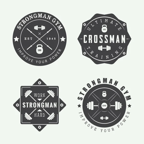 Set of gym logos, labels and slogans in vintage style. — Stock Vector