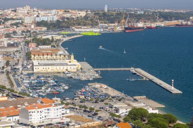 Scenic aerial view of setubal fishing port, doca pesca setubal, and sado river estuary in setubal, portugal, bathed in sunlight