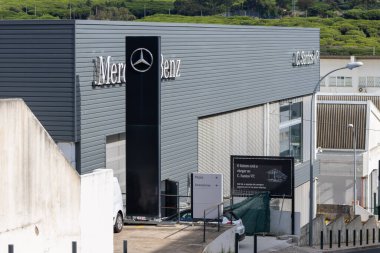 Mercedes benz dealership building of c. Santos vp in alfragide, portugal, showing the logo and company name