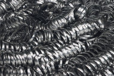 Parlak metal talaşları soyut endüstriyel doku kalıbı oluşturuyor