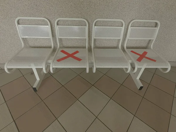 chairs symbol personal distancing no people sitting with crosses