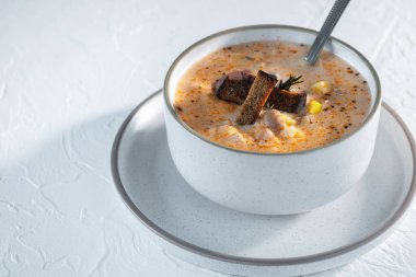 Cheese cream soup with mushrooms, potatoes and croutons, tasty first course