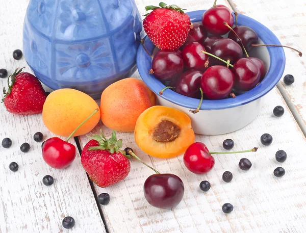 Fresh berries on a white wooden background with space for the text. — Stock Photo, Image