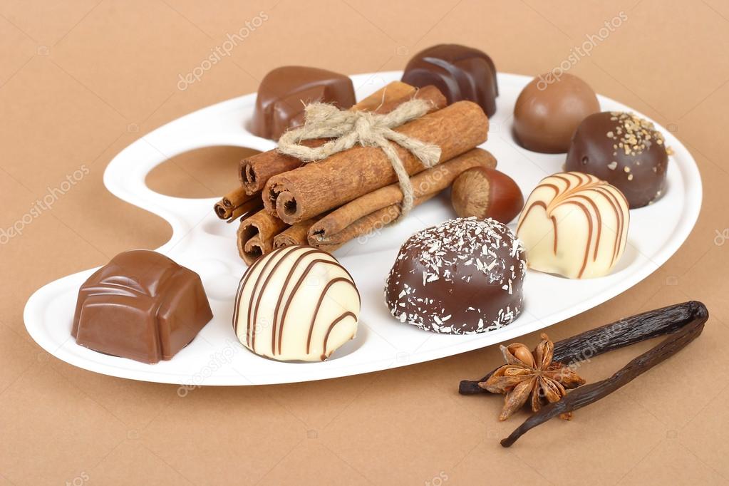 Chocolates and nuts on a white background.