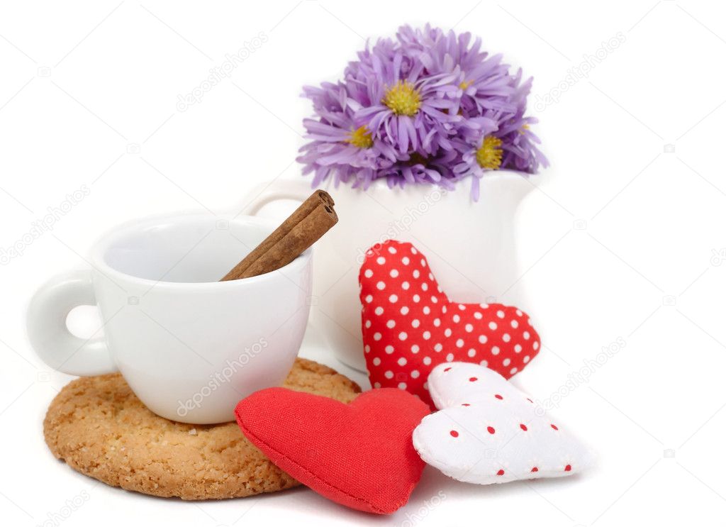 Cup and textile hearts on a white background.