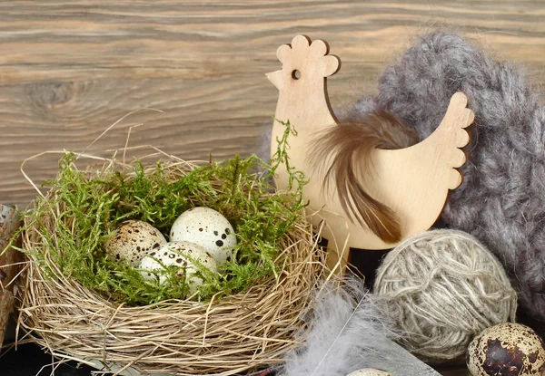 Easter eggs in a nest on wooden a rustic a background. — Stock Photo, Image