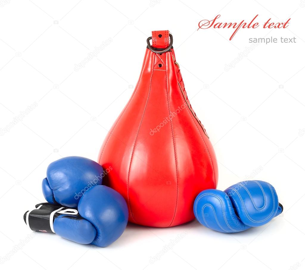 Punching bag and boxing gloves on a white background. Sports background. A sports equipment for training.