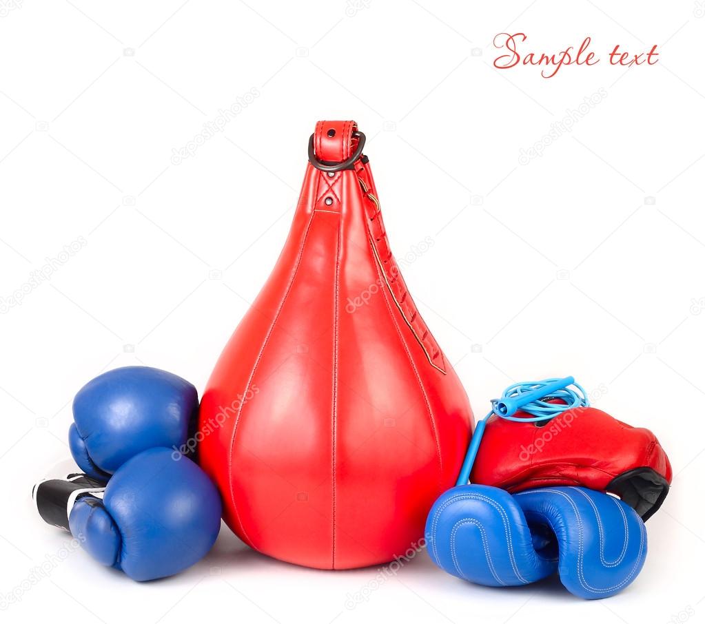 Punching bag and boxing gloves on a white background. Sports background. A sports equipment for training.