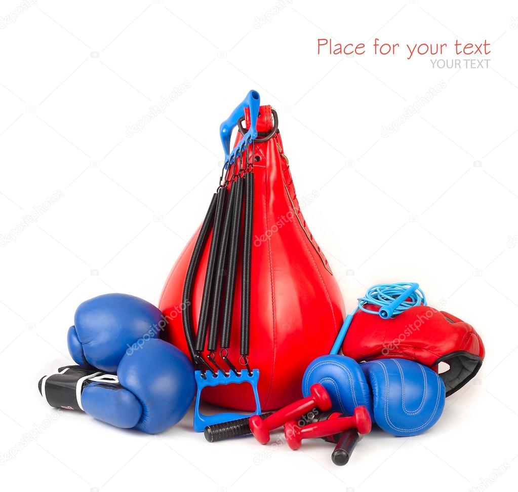 Punching bag, boxing gloves and other sports equipment on a white background.