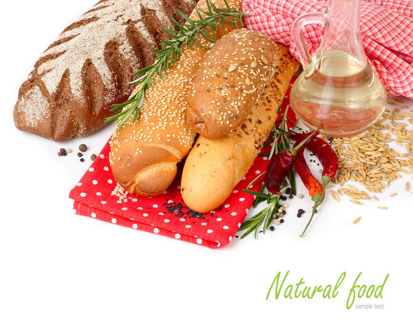 Fresh fragrant bread and rosemary on a white background.