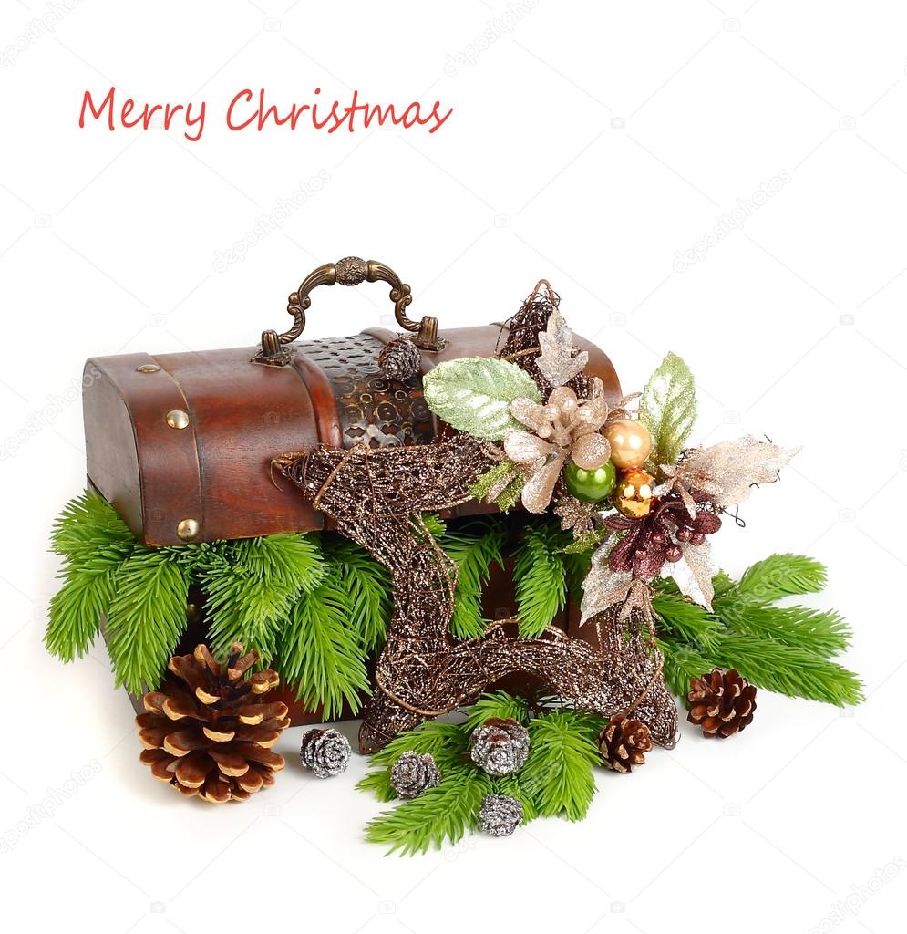 Wooden chest with branches of a Christmas tree and a decorative Christmas star on a white background. A Christmas background with a place for the text.