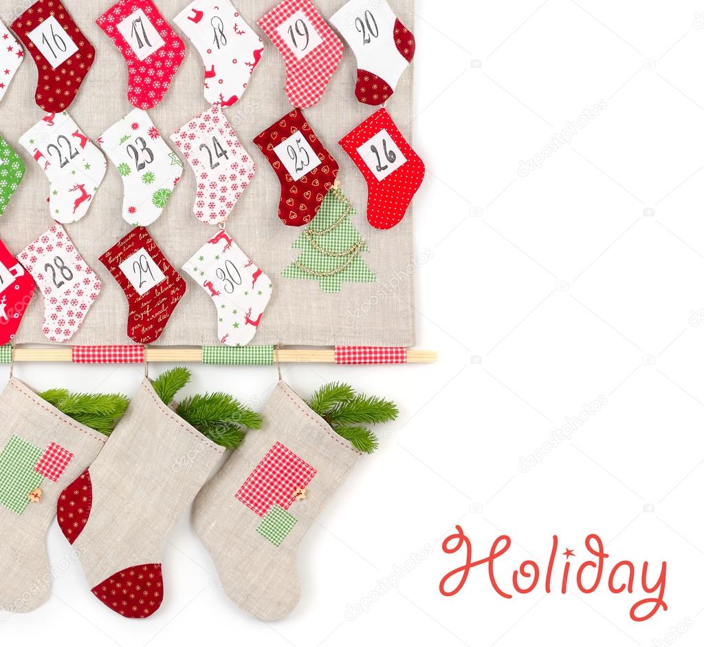 Christmas calendar with bright socks on a white background. A Christmas background with a place for the text.