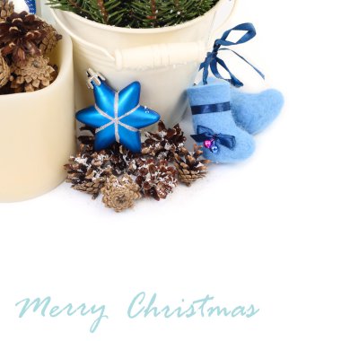 Christmas composition with woolen socks and cones on a white background. A Christmas background with a place for the text.