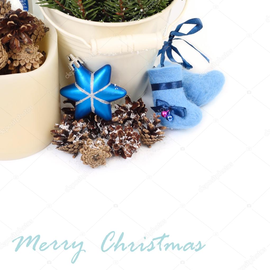 Christmas composition with woolen socks and cones on a white background. A Christmas background with a place for the text.
