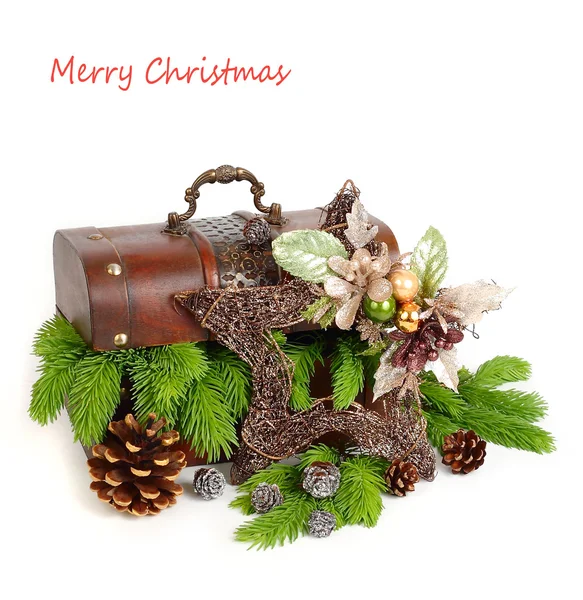 Wooden chest with a decorative Christmas star, cones and fluffy branches of a Christmas tree on a white background. A Christmas background with a place for the text. — Zdjęcie stockowe