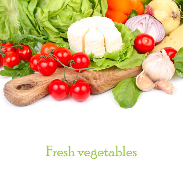 Cheese Ricotta and fresh ripe vegetables and herbs on a beautiful kitchen chopping board on a white background with a place for the text.