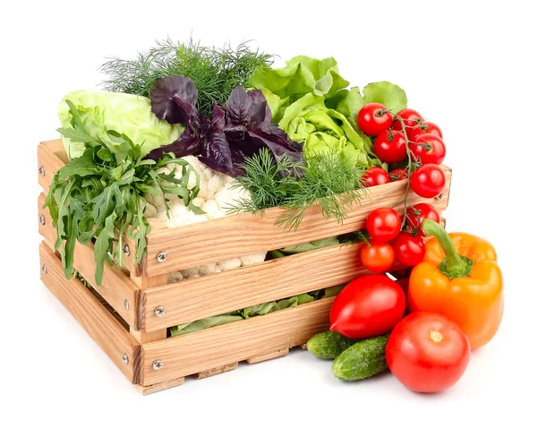 Fresh ripe vegetables in a wooden box on a white background with a place for the text. — Stock Image Fresh ripe vegetables in a wooden box on a white background with a place for the text. Royalty Free Stock Photos