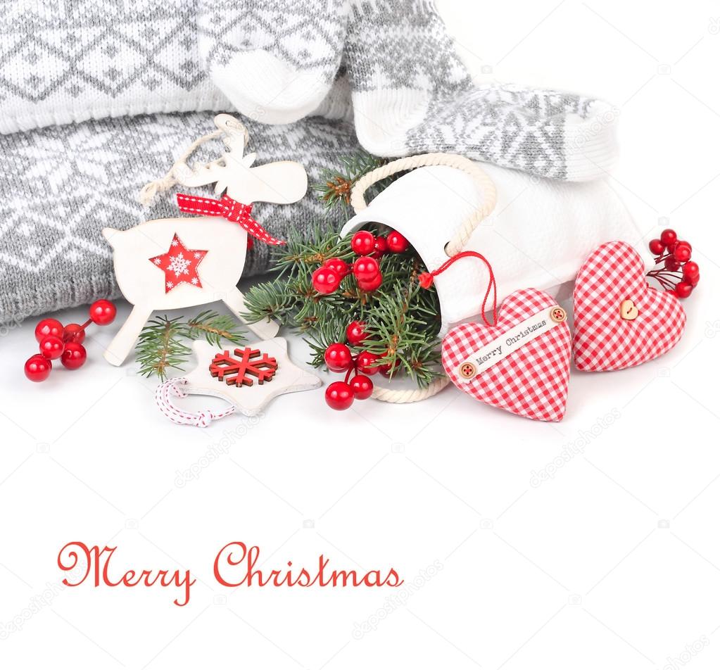 Christmas background with red-white jewelry in the Scandinavian style on a white background with a place for the text. The Scandinavian style in an interior.