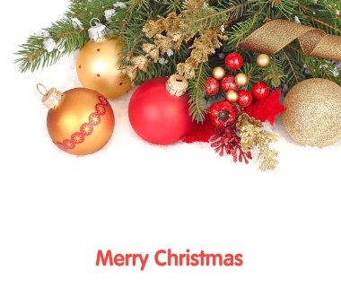 Red and golden Christmas balls on branches of a Christmas tree on snow on a white background. A Christmas background with a place for the text.