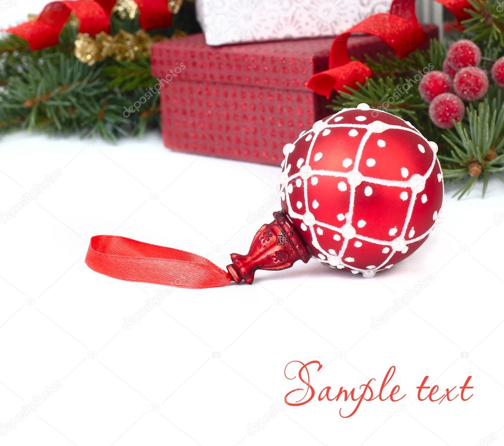 Red Christmas ball and Christmas gift boxes on a white background. A Christmas background with a place for the text.