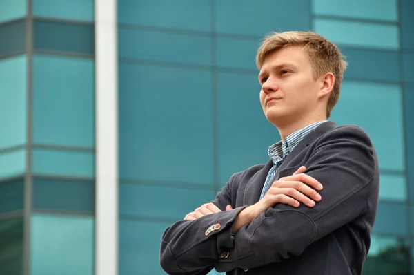 stock image Business man on the background of a modern building