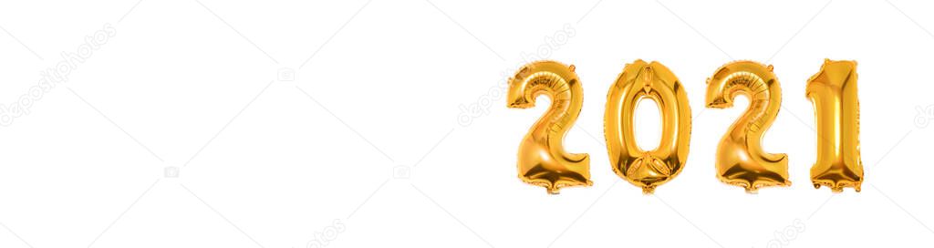 Foil Golden Christmas 2021 balloons in form of numbers isolated on white background. Happy New Year 2021. Flat lay, top view. Banner.Copy space for text