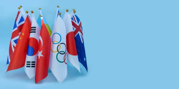 stock image Ukraine, Kharkov, 2021, April 16. Olympic flag and flags of the countries of the world. Olympic Games Tokyo 2020. Copy space for text