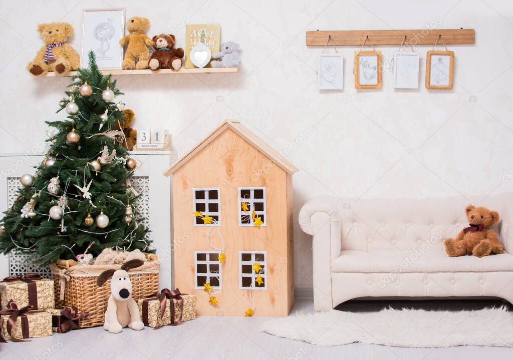 Children's Christmas room. Christmas tree with boxes of gifts, children's furniture and toys, home interior