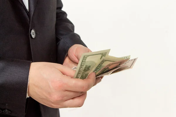 Empresário contando dinheiro em um fundo branco — Fotografia de Stock