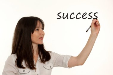 iş kadın beyaz bir arka plan üzerinde başarı metin yazma